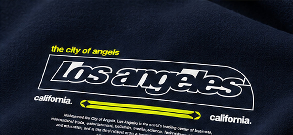 Close-up Los Angeles California typography neon yellow accent print on navy hoodie