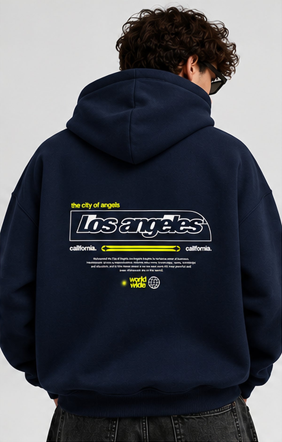 Male model rear view of navy Los Angeles graphic 390+ GSM oversized hoodie