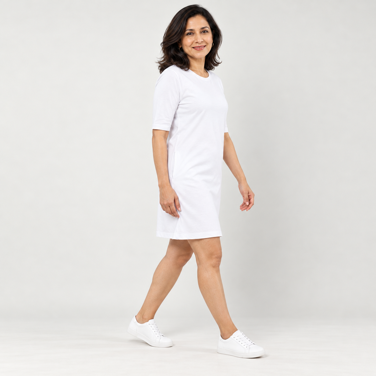 RELAX MODE white cotton T-shirt dress – three-quarter walking angle
