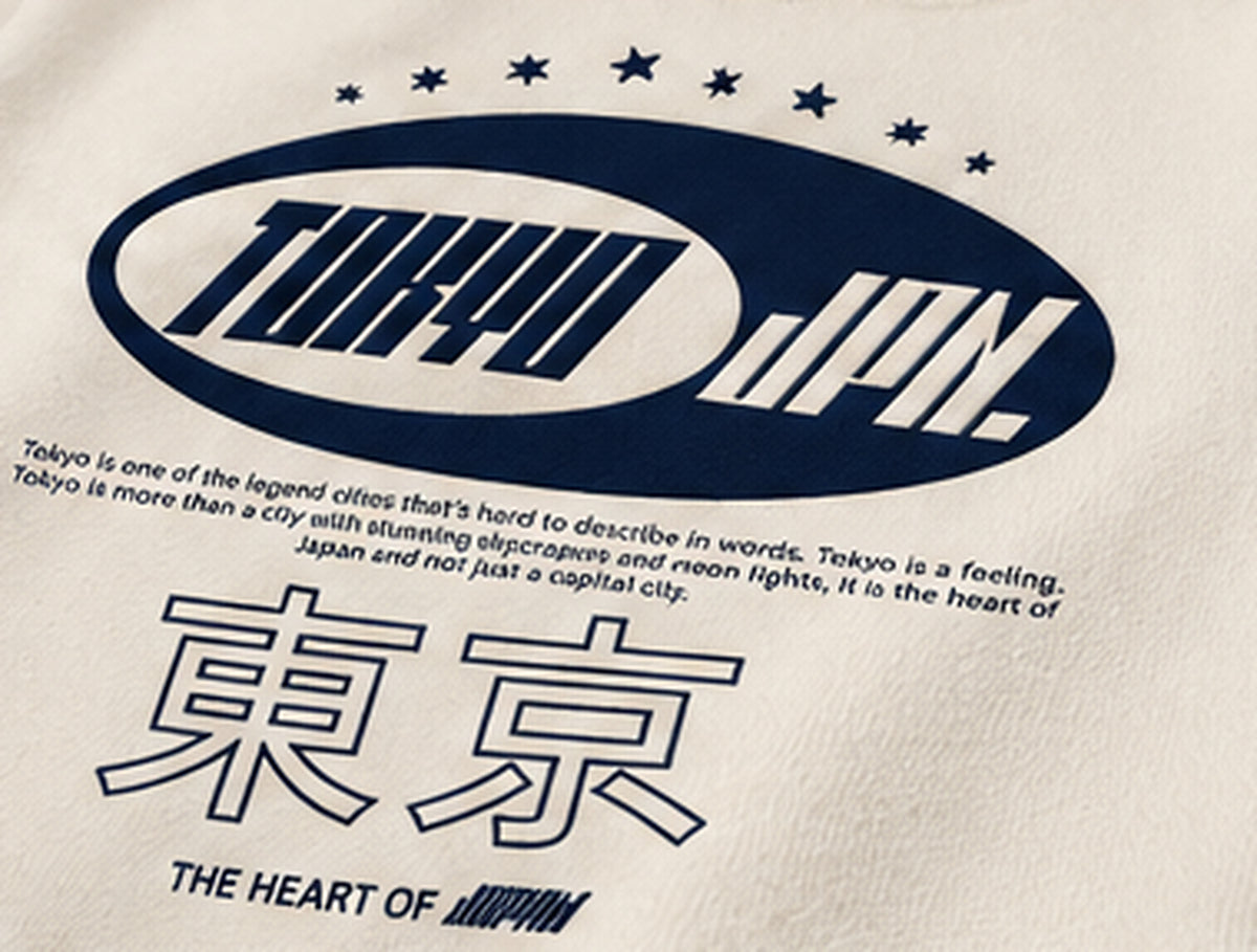 Close-up navy Tokyo JPN and Japanese characters print on cream fleece hoodie