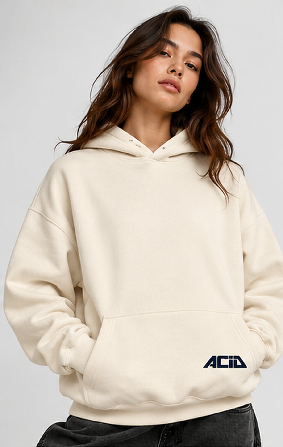 Female model front view cream oversized hoodie navy ACID pocket logo