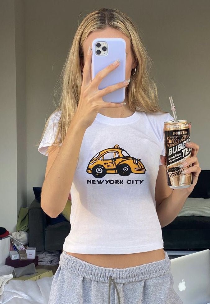 NYC Taxi Baby Tee | White New York City Graphic Crop Top - Y2K Aesthetic Tee for Women - Acid House™ (formerly Zyra Drip)